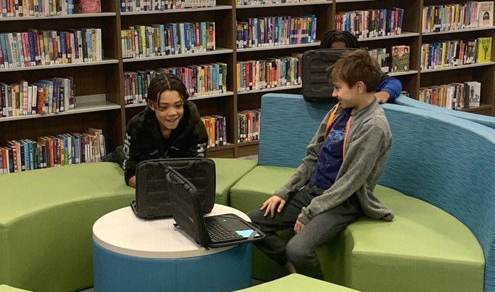 Middle School students working in the library
